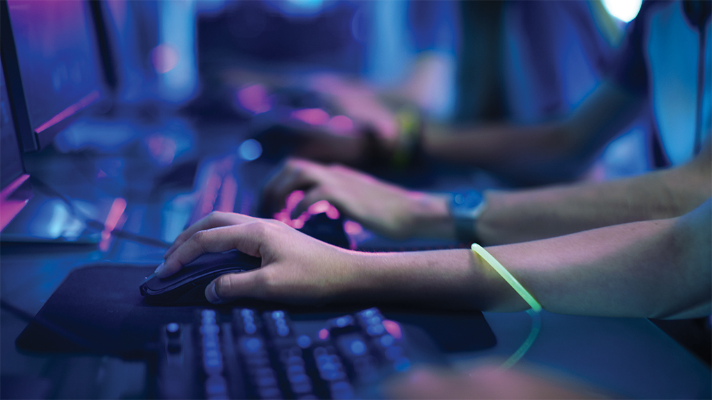 Students hands at a gaming keyboard
