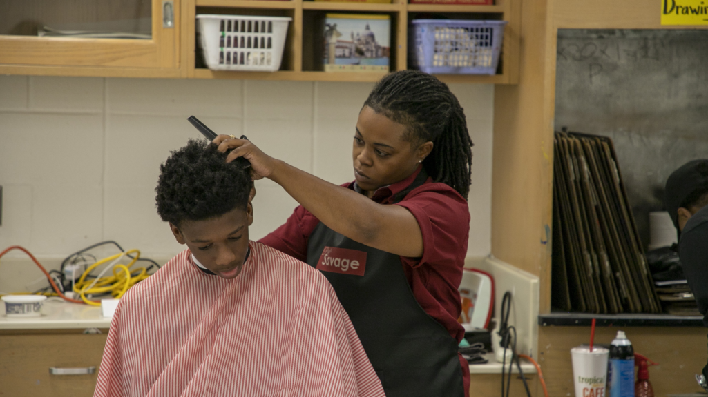 a student receives a haircut