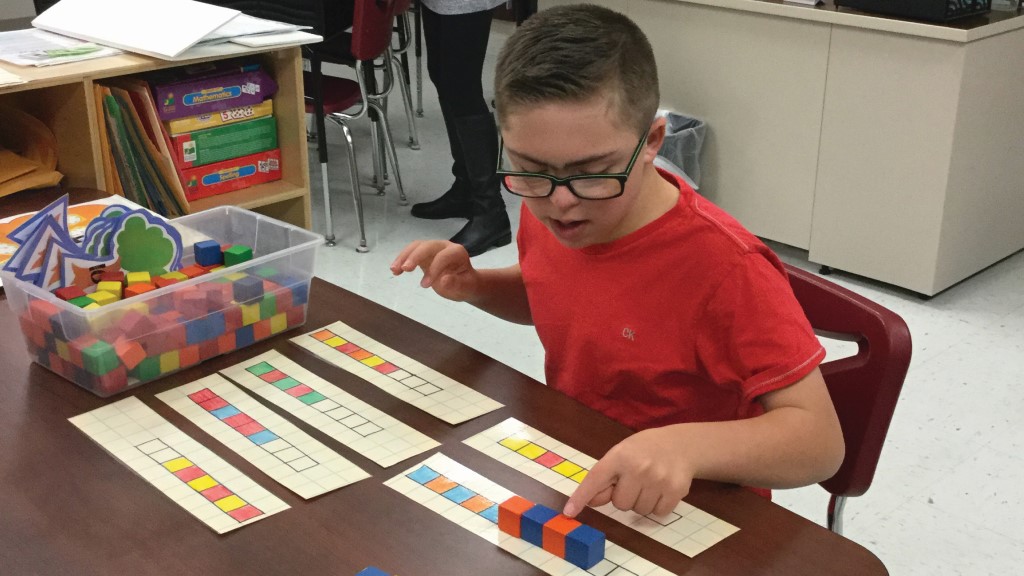 A Boyce Middle School student working on one-to-one math skills and continuing patterns in a resource classroom.
